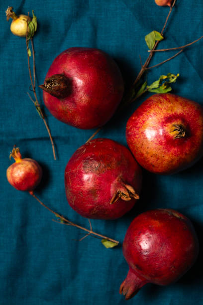 istock Ripe red pomegranates on a turquoise linen napkin 2178097171