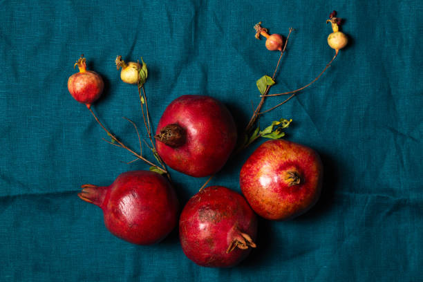 istock Ripe red pomegranates on a turquoise linen napkin 2178097176
