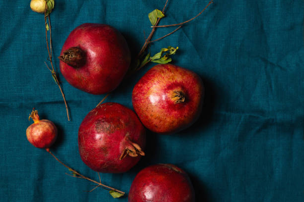 istock Ripe red pomegranates on a turquoise linen napkin 2178097186