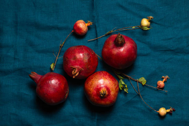 istock Ripe red pomegranates on a turquoise linen napkin 2178097187
