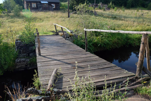 istock view of a wooden bridge over a mountain river 2178100942