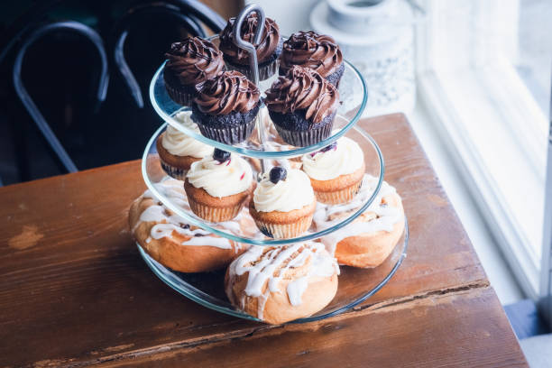 Blueberry and chocolate cup cakes,  cinnamon rolls, rusting surroundings, luxurious feeling