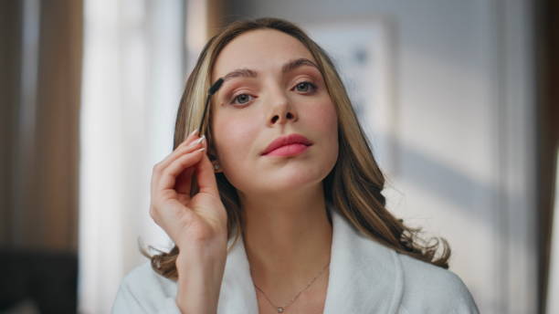 istock Pov model making eyebrows styling looking mirror at home. Woman posing camera 2178105426