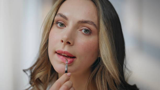 istock Pov girl applying lipstick getting ready preparing for romantic date indoors 2178107572