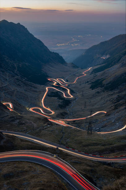istock Transfagarasan mountain road with car light trails 2178109154