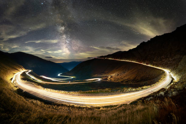 istock Transfagarasan mountain road with car light trails and Milky Way 2178109168