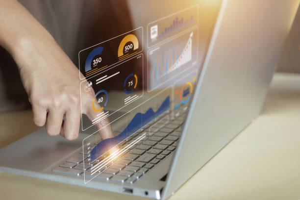 istock A person is pointing at a laptop screen with a graph on it 2178109867