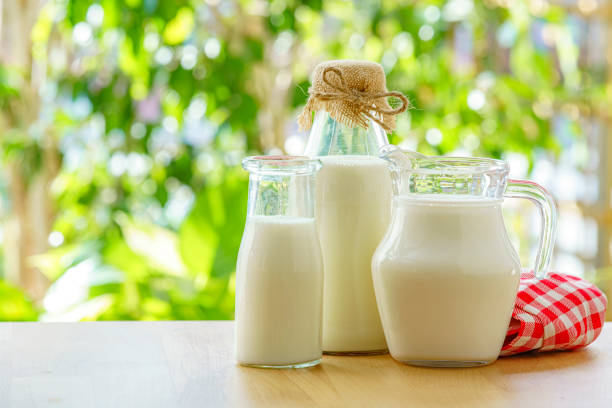 istock Milk bottles on the table outdoors 2178111669