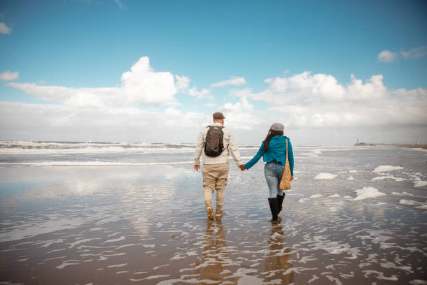 istock A senior diverse couple on a date during a wintry beach getaway 2178122100