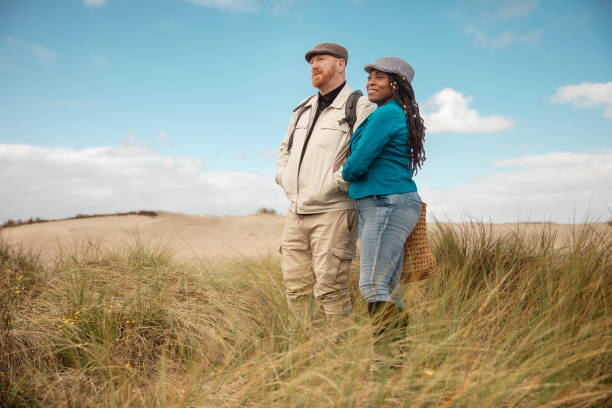 istock A senior diverse couple on a date during a wintry beach getaway 2178122196