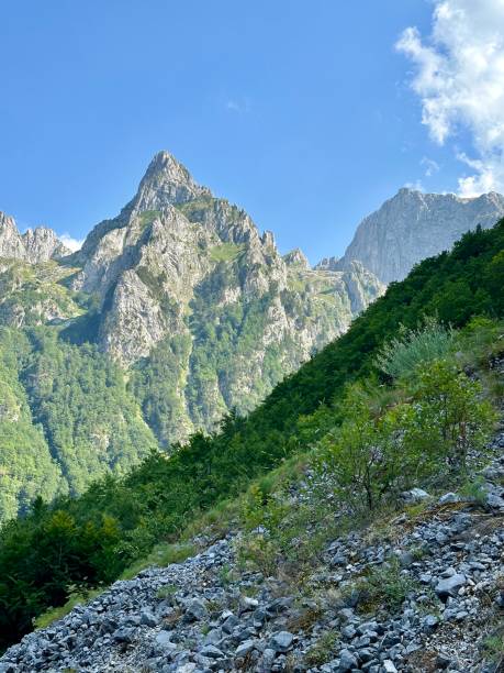 istock Steep rocky mountain slope towering against the bright blue sky 2178125306
