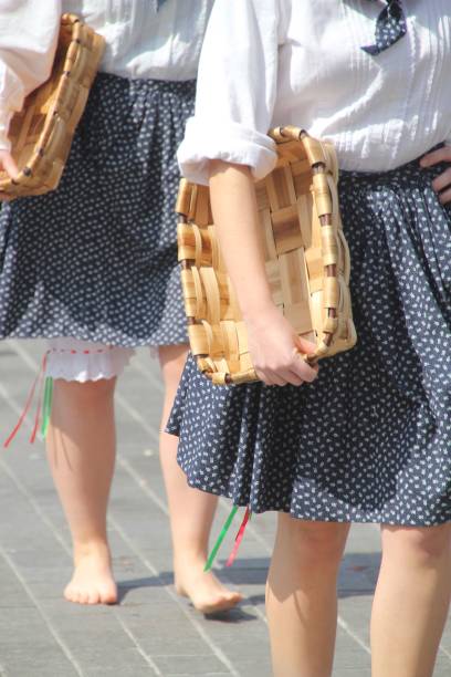 istock Women in traditional attire with woven baskets 2178125475