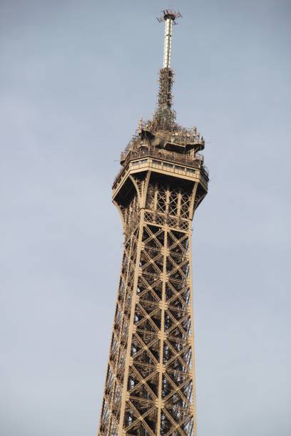 istock Close-up of the Eiffel Tower's top section against a clear sky 2178125486