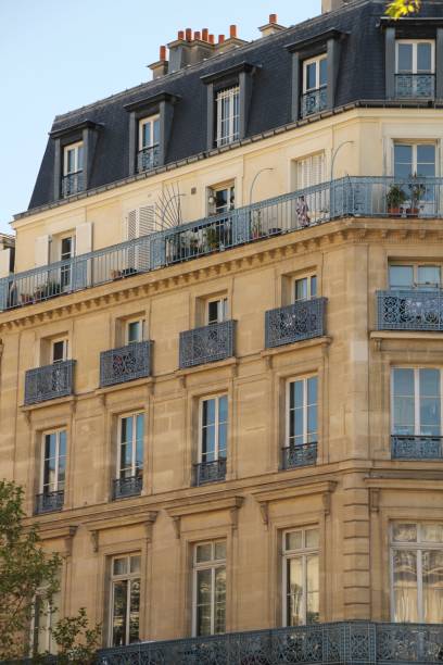istock Classic Parisian Apartment Building with Wrought Iron Balconies 2178127024