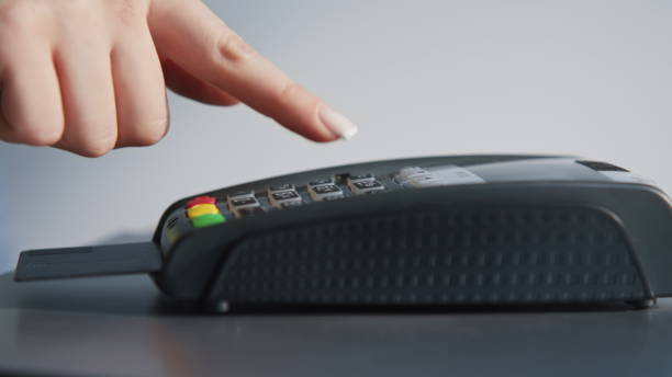 istock Female fingers entering pin code on terminal closeup. Woman hand inserting card 2178128070