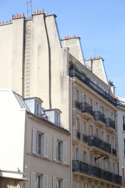 istock Classic Parisian buildings with ornate balconies and chimneys 2178129380