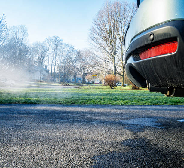 istock Exhaust Vapor From Tail Pipe of Car With Engine Idling 2178133275