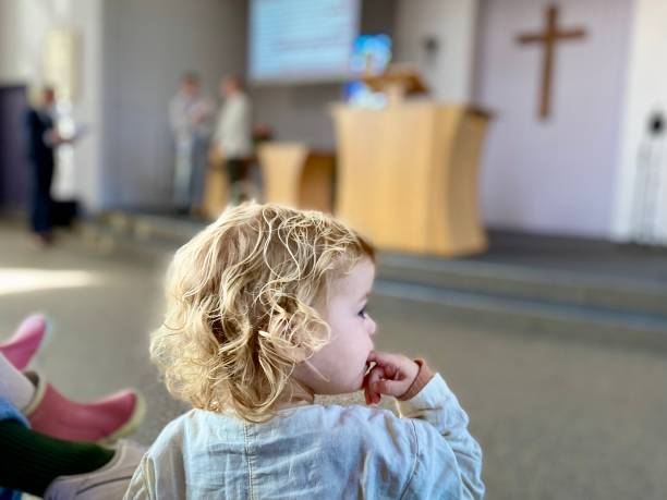 Toddler boy present in Church at a special Service