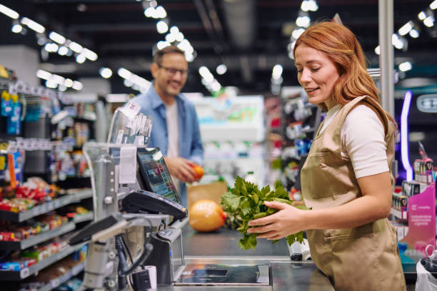 istock Grocery Store Interaction Between Friendly Cashier and Customer 2178134542