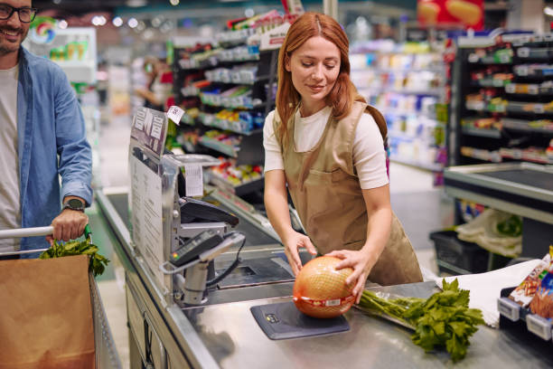 istock Grocery Store Interaction Between Friendly Cashier and Customer 2178134552