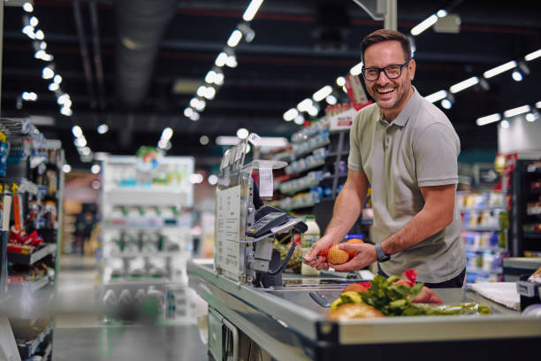 istock Smiling Cashier Working in Supermarket 2178134871