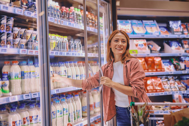 istock Woman buying milk 2178135040