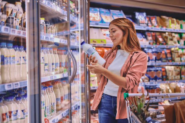 istock Woman buying milk 2178135045