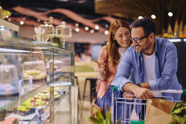 istock Young Couple Looking at Cakes in a Pastry Shop 2178135286