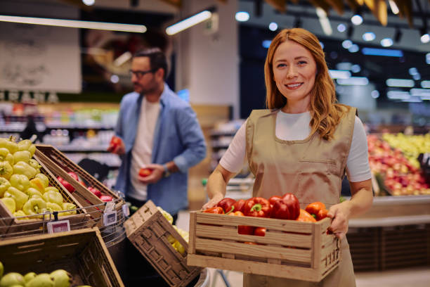 istock Friendly Grocery Store Employee Holding Fresh Produce Box with Vegtetables 2178135557