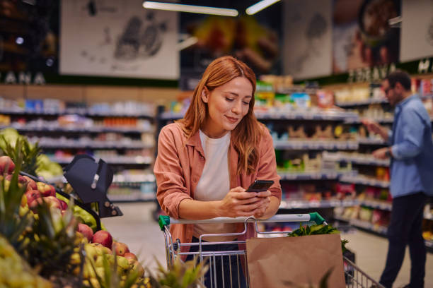 istock Purchasing Goods with Smartphone at Grocery Store 2178135593