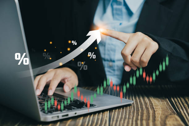 istock Businessman analyzing financial data on a laptop, with graphs and growth indicators, illustrating market trends. 2178135873
