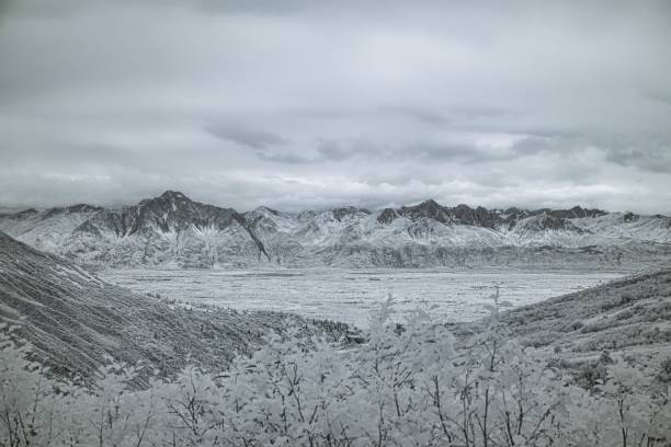 istock Snow-covered mountains and valley in winter. 2178137045