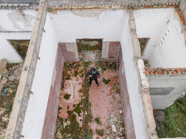 istock Apocalypse, man wearing gas mask at destroyed building 2178137250