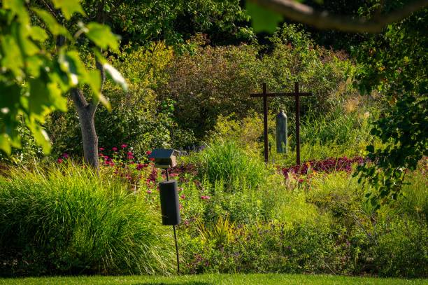 istock Serene garden with lush greenery and a wind chime 2178137831