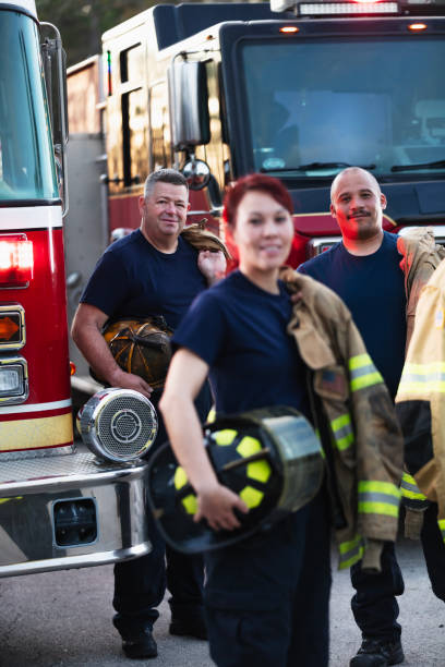 istock Multiracial group of three firefighters smiling at camera 2178143633