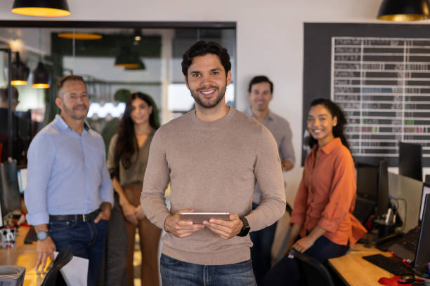 istock Successful business man leading a team at the office 2178146220