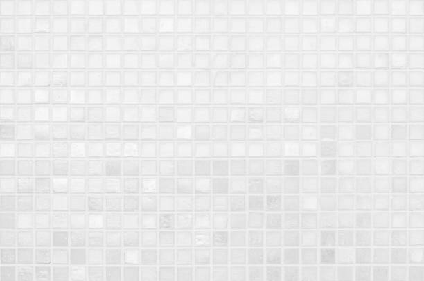 istock White tile wall chequered background bathroom texture. Ceramic brick wall and floor tiles mosaic background in bathroom and kitchen clean. Design pattern geometric with grid wallpaper decoration. 2178147135