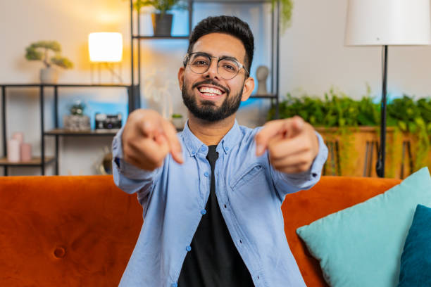 istock Happy satisfied Indian man smiling and pointing to camera, choosing lucky winner selecting approve 2178147285