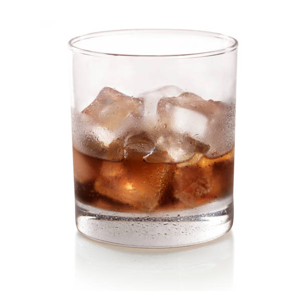 istock glass of whiskey with ice on white background in studio 2178148455