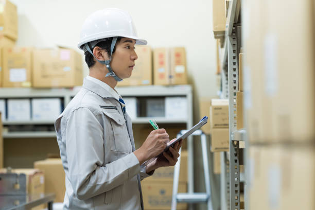 istock A man managing luggage in a warehouse 2178153111