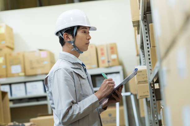 A man managing luggage in a warehouse