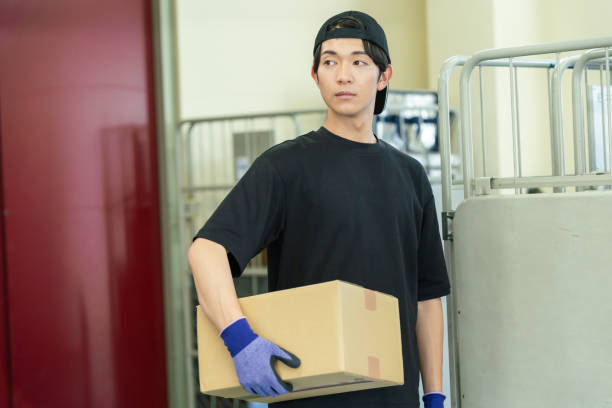 istock A man managing luggage in a warehouse 2178153225