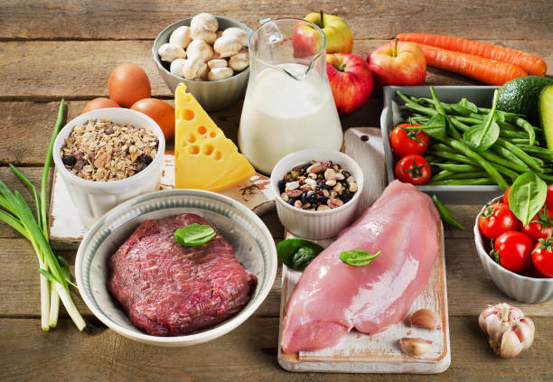 istock Assortment of Fresh Vegetables and Meats for Healthy Diet on rustic table. 2178154843