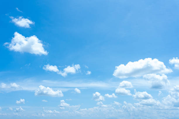 istock Fluffy cumulus clouds drift across a clear blue sky, casting soft shadows on the Earth 2178155086