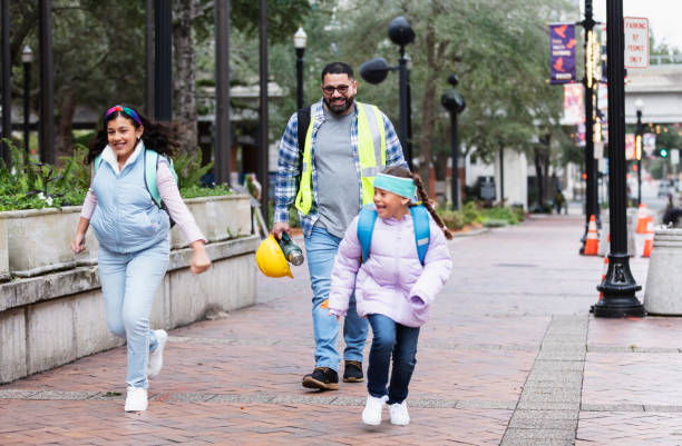 istock Construction worker father takes daughters to school 2178155882