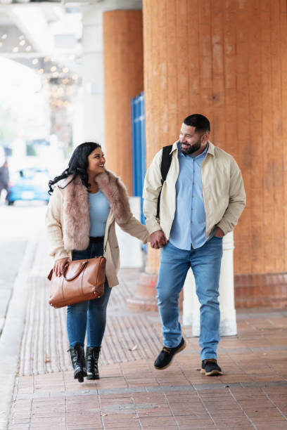 istock Mature Hispanic couple walking, holding hands in city 2178155948