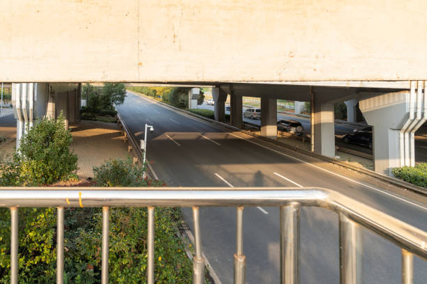 Concrete structure and asphalt road space under the overpass in the city