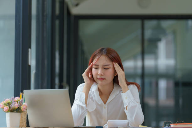 istock Asian businesswoman working on a laptop computer, stressed has a headache, and thinks hard from work at the office. 2178158374