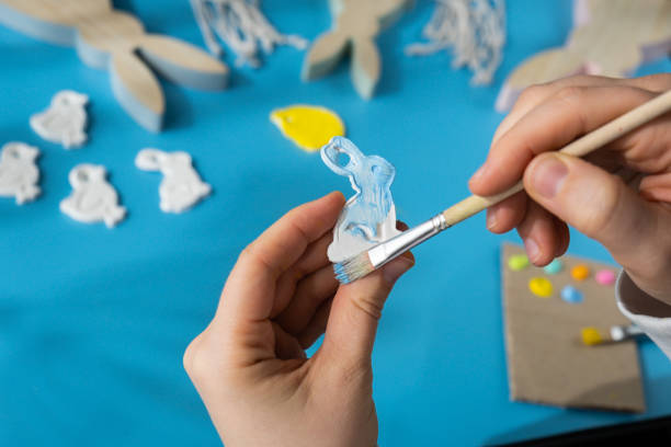 Master class of coloring Children air dry clay activity handicraft idea. DIY process step by step instruction. Preparing for Easter holiday decorating. Modern organic design minimalistic plastic free sustainable decor