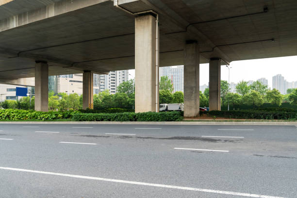 istock Concrete structure and asphalt road space under the overpass in the city 2178161989